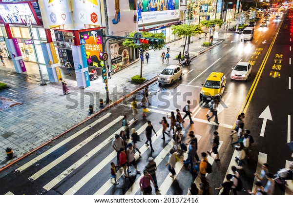 TAIPEI, TAIWAN, 22 JUNE 2014: Zebra pedestrian walking\
through the streets of Taipei on the road,22 JUNE 2014 in\
taipei,taiwan 