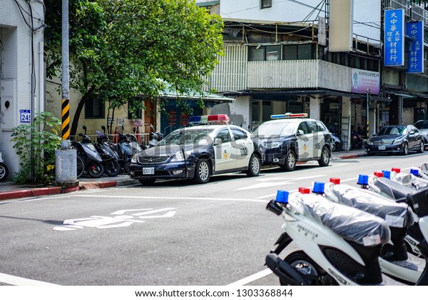 Taipei, TAIWAN - 3 Oct, 2017: Taiwan\
Police cars and motocycle were parking beside the street near\
police station. They ready to use in duty., Taipei, Taiwan\
