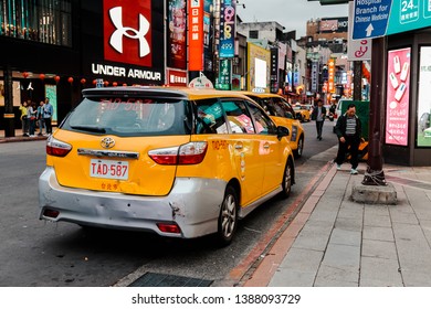 Taipei, Taiwan - April 12, 2019: Yellow Van Taxi Park And Wait For The Passenger In Front Of Ximending, The Most Popular Commercial Or Shopping District In Taipei