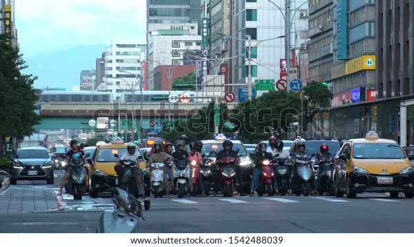 TAIPEI, TAIWAN - CIRCA AUGUST 2019 : Scenery of\
street traffic of Nanjing road. A major arterial, connecting the\
Datong district in the west with the Zhongshan and Songshan\
districts in the east.