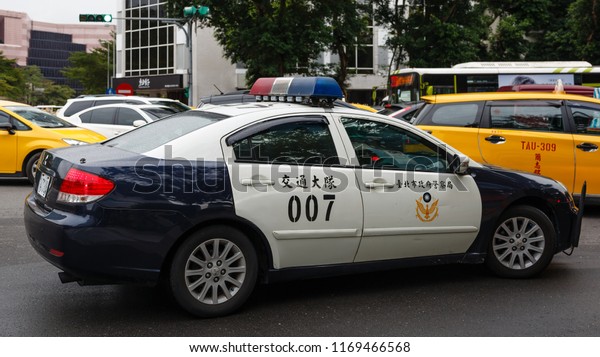 Taipei, Taiwan - December 25 2015: Taipei,\
Taiwan: Police car 1471-UW of Traffic Division, Taipei City Police\
Department at Section 4, Ren\'ai\
Road.