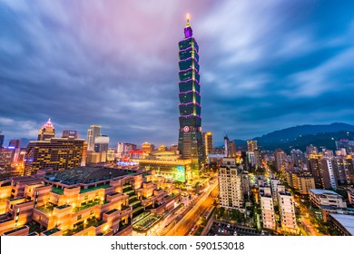 TAIPEI, TAIWAN - FEBRUARY 26, 2017: Taipei 101 towers over the Xinyi District at twilight. The skyscraper was briefly the world's tallest from 2004-2009.