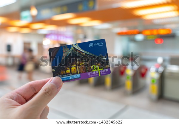 Taipei, Taiwan - June 19, 2019 : Using subway\
system in Taipei by 24hr Taipei Metro Pass. Once activated by\
scanning at the gates, it is valid for unlimited travel on the\
Taipei Metro for 24\
hours.