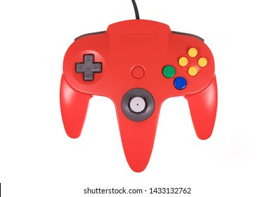 Taipei, Taiwan - May 31, 2019: A Floating Red Nintendo 64 Controller Isolated On A White Background