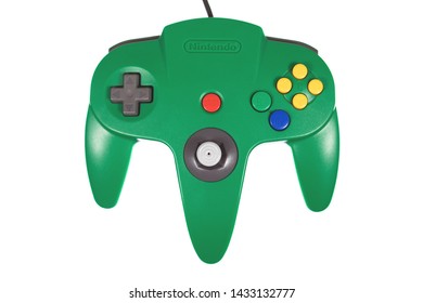 Taipei, Taiwan - May 31, 2019: A Floating Green Nintendo 64 Controller Isolated On A White Background