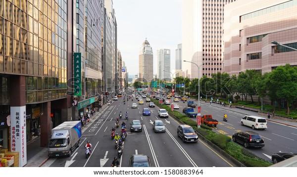 Taipei/Taiwan 08.14.2019\
Traffic on central\
street. traffic during rush hour in the capital of Taiwan. traffic\
jams in a modern asian city among\
skyscrapers