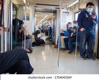 TAIPEI,TAIWAN - Apr 14 :Passengers wearing face mask in mass transit system on April 14,2020 in Taipei,Taiwan.There have been 1812734 confirmed cases of COVID-19,including 113675 deaths on Apr 14,2020 - Shutterstock ID 1704043369