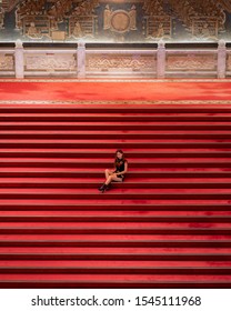 Taipei/Taiwan - September 2019: Asain Girl Sitting On The Grand And Oriental Looking Staircase Of The Grand Hotel Taipei 