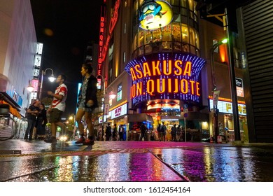 TAITO CITY, TOKYO / JAPAN -  October 11, 2019: People Walking In Front Of Crowded Don Quijote, A Popular Japanese Discount Convenience Store, At Night A Day Before A Typhoon. 