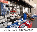 Taito Ward, Tokyo, Japan - May 11, 2024: Kappabashi Dougu Street. It is a shopping street lined with kitchen-related wholesalers.