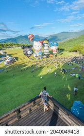 Taitung, Taiwan - August 29, 2021: Various Shape Balloons With Beautiful Sunrise And Green Grass At Luye Highland, Taiwan International Balloon Festival