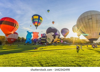 Taitung, Taiwan - June 30, 2019: Various Shape Balloons With Beautiful Sunrise And Green Grass At Luye Highland, Taiwan International Balloon Festival