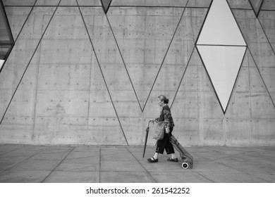 Taiwan - February 22.2015: Chinese Old Woman Walking In The Kaohsiung City Dadong Arts Center