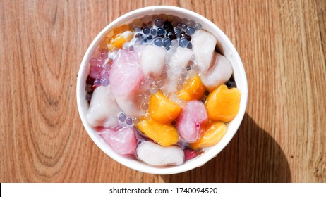 Taiwanese traditional dessert with Jelly and Taro Ball in paper bowl