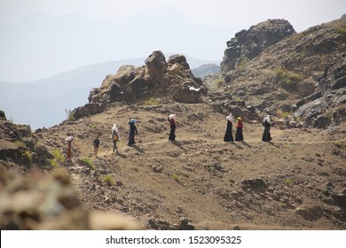 Taiz  Yemen - 02 Apr 2017: Women Bring Their Food And Drink Needs Through Rugged Mountain Roads Because Of  Al-Houthi Militia Siege Of The Villages Of Jabal Habashi District In The  West Of Taiz City