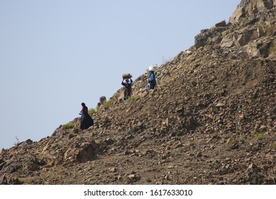 Taiz  Yemen - 02 Apr 2017: Women Bring Their Food And Drink Needs Through Rugged Mountain Roads Because Of Al-Houthi Militia Siege Of The Villages Of Jabal Habashi District In The West Of Taiz City