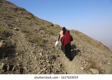 Taiz / Yemen - 02 Apr 2017: Women Bring Their Food And Drink Needs Through Rugged Mountain Roads Because Of Al-Houthi Militia Siege Of The Villages Of Jabal Habashi District In The West Of Taiz City