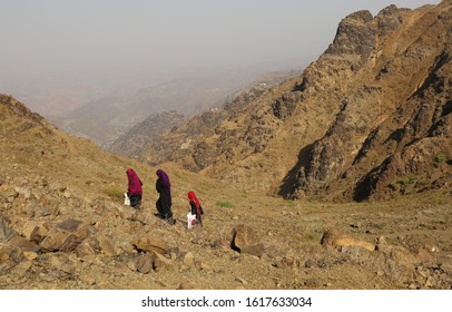 Taiz  Yemen - 02 Apr 2017: Women Bring Their Food And Drink Needs Through Rugged Mountain Roads Because Of Al-Houthi Militia Siege Of The Villages Of Jabal Habashi District In The West Of Taiz City