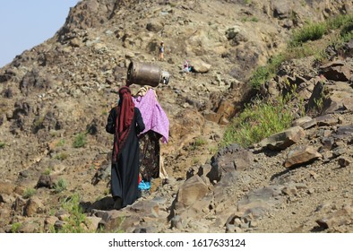 Taiz / Yemen - 02 Apr 2017: Women Bring Their Food And Drink Needs Through Rugged Mountain Roads Because Of Al-Houthi Militia Siege Of The Villages Of Jabal Habashi District In The West Of Taiz City