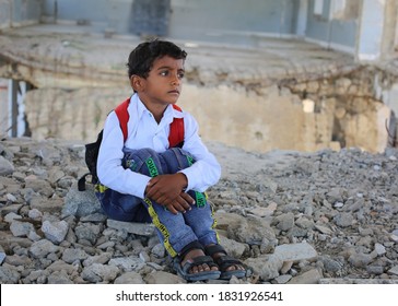 Taiz  Yemen - 07 Oct 2020  : A Sad Yemeni Child Sits On The Rubble Of His School, Destroyed By The War