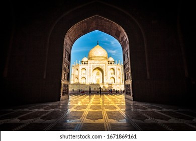 Taj Mahal in Agra city is an ivory-white marble mausoleum on the banks of the Yamuna river in Uttar Pradesh India. Taj Mahal views while sunset with clear blue sky. Architecture of Taj Mahal. - Image