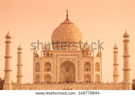 The Taj Mahal of India from the front up close with a warm color tone.