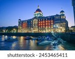 Taj Mahal Palace Hotel at twilight. Iconic Indian luxury hotel  in Mumbai, India.