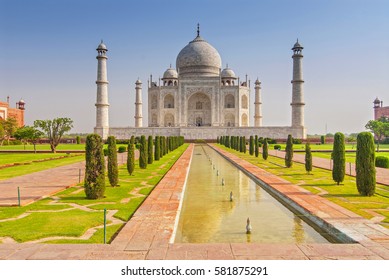 Taj Mahal tomb with reflection in the water in Agra, Uttar Pradesh, India.