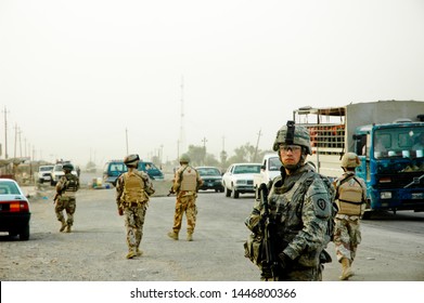 TAJI, IRAQ, August 8th, 2008 - US Army Soldiers From The 25th Infantry Division Conducting A Patrol.