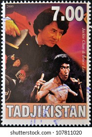 TAJIKISTAN - CIRCA 2000: A stamp printed in Tajikistan shows Bruce Lee and Jackie Chan, circa 2000