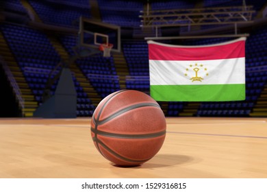 Tajikistan Flag And Basketball On Court Floor