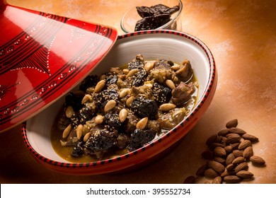 tajine with meat plum almond and sesame seeds
