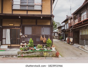 Takayama/Japan - November 18, 2019: A  Small Container Garden Near A Wooden House.