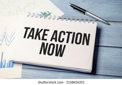 Take Action Now Words On Notebook Closeup