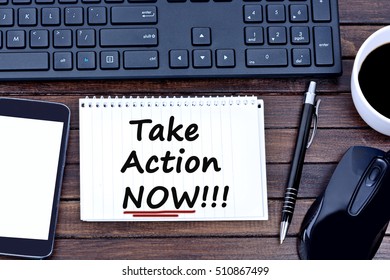 Take Action Now Words On Notebook Closeup