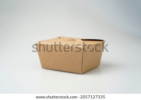 Take away box disposable food container craft paper mock up on grey background with copy space. Delivery food concept.
