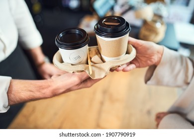 Take Away Coffee. Closeup Of Barista Serving Takeaway Cups Of Coffee