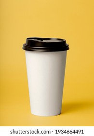 take away coffee on color background