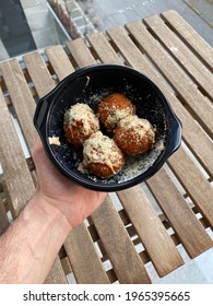 Take Away Fried Mac And Cheese Balls With Parmesan Cheese Macaroni Bites In Plastic Plate Box Package Container. Holding In Hand.