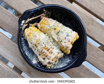 Take Away Grilled Corn On The Cob With Parmesan Cheese In Plastic Plate Box Package Or Container.