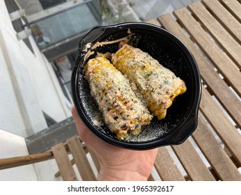 Take Away Grilled Corn On The Cob With Parmesan Cheese In Plastic Plate Box Package Or Container.