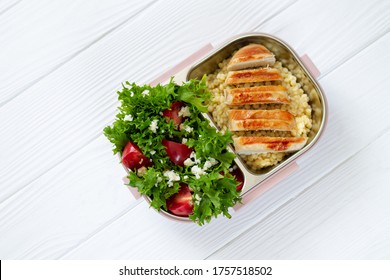 Take Away Lunch In Reusable Lunchbox With Healthy Food Top View