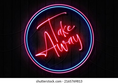 Take Away Neon Sign on a Dark Wooden Wall - Powered by Shutterstock