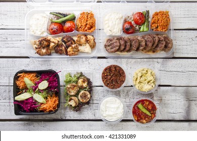 A Take Away Plate With Gyros Meat And Salad On Top View White Wood Background