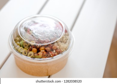 Take Away Salad In Disposable Craft Paper Bowl On White Background. Minimalism Food Photography Concept. Mockup, Copyspace