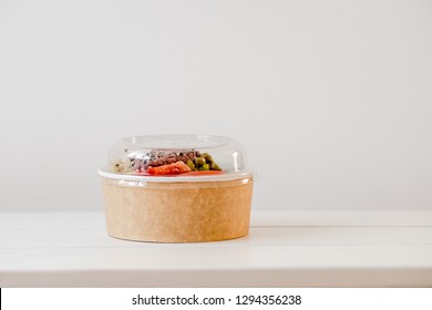 Take Away Salad In Disposable Craft Paper Bowl On White Background. Minimalism Food Photography Concept. Mockup, Copyspace