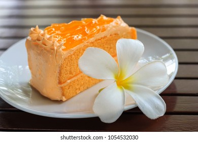 take a break with orange soft cake in coffee shop 