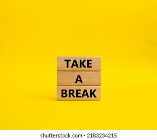 Take A Break Symbol. Concept Words 'Take A Break' On Wooden Blocks. Beautiful Yellow Background. Business And Take A Break Concept. Copy Space.