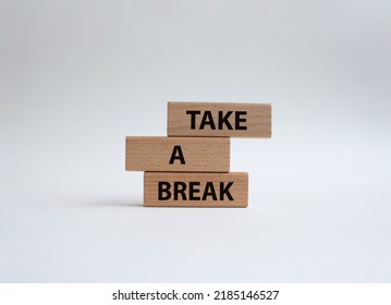 Take A Break Symbol. Concept Words 'Take A Break' On Wooden Blocks. Beautiful White Background. Business And Take A Break Concept. Copy Space.