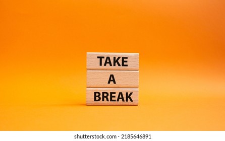 Take A Break Symbol. Concept Words 'Take A Break' On Wooden Blocks. Beautiful Orange Background. Business And Take A Break Concept. Copy Space.